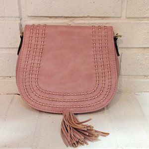 Elegant Blush Pink Saddle Bag with Tassel Charm and Hand-Stitched